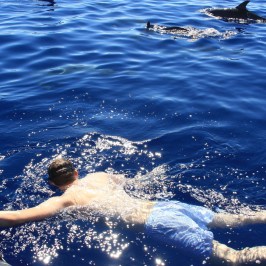 a man riding a wave on top of a body of water
