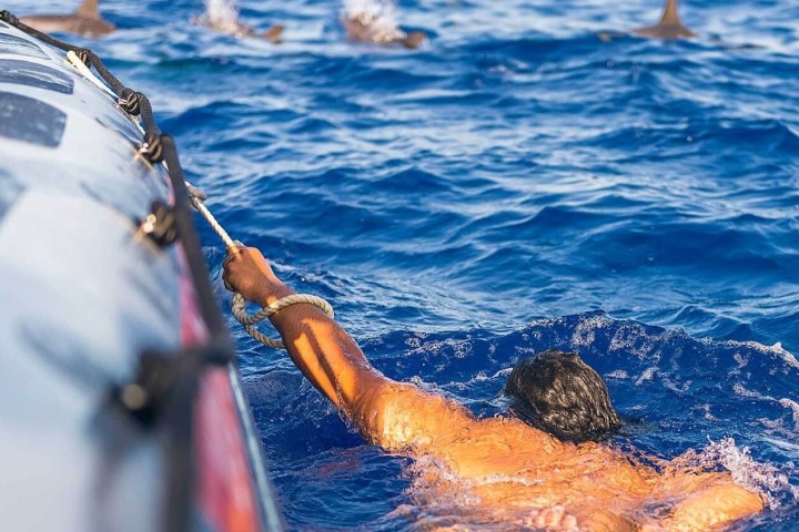 a person riding a surf board in the water
